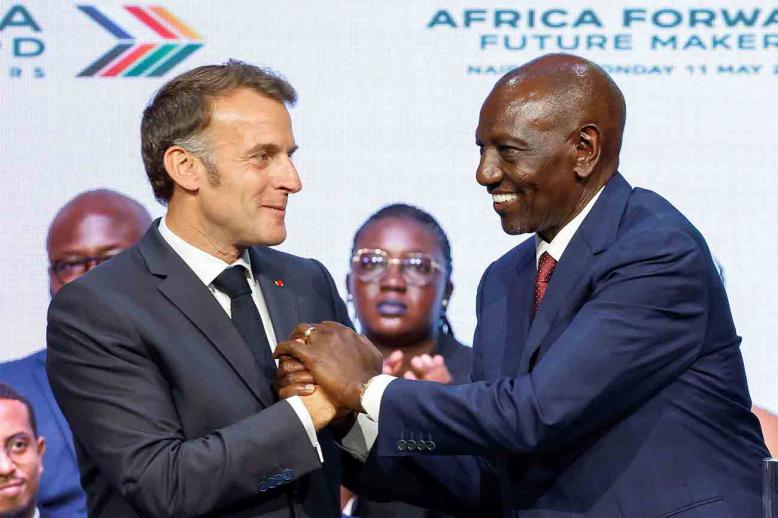 Macron and Kenya's President William Ruto shake hands during the Africa Forward Summit 2026 