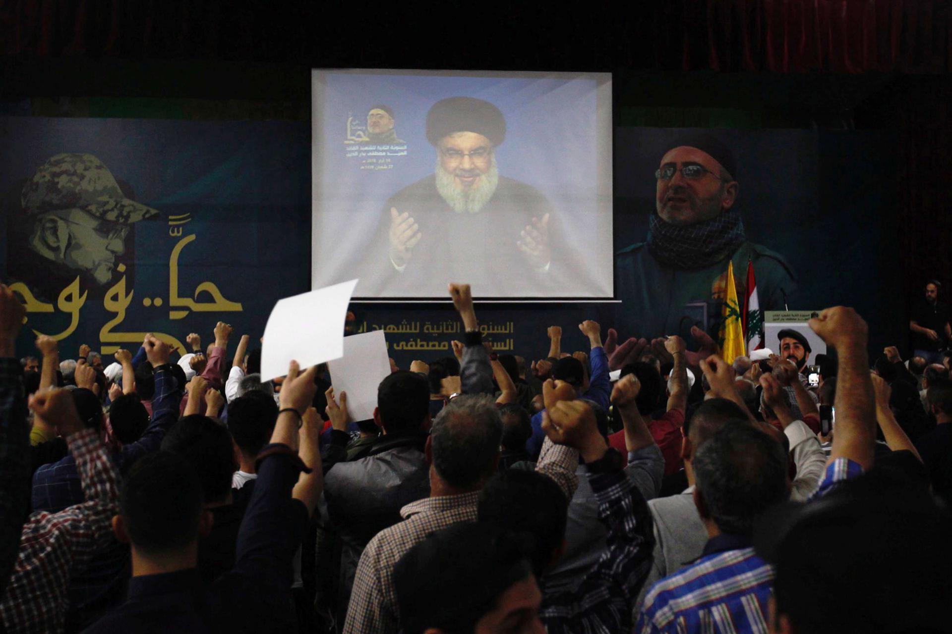 Lebanon's Hezbollah leader Sayyed Hassan Nasrallah is seen on a video screen as he addresses his supporters in Beirut, Lebanon.