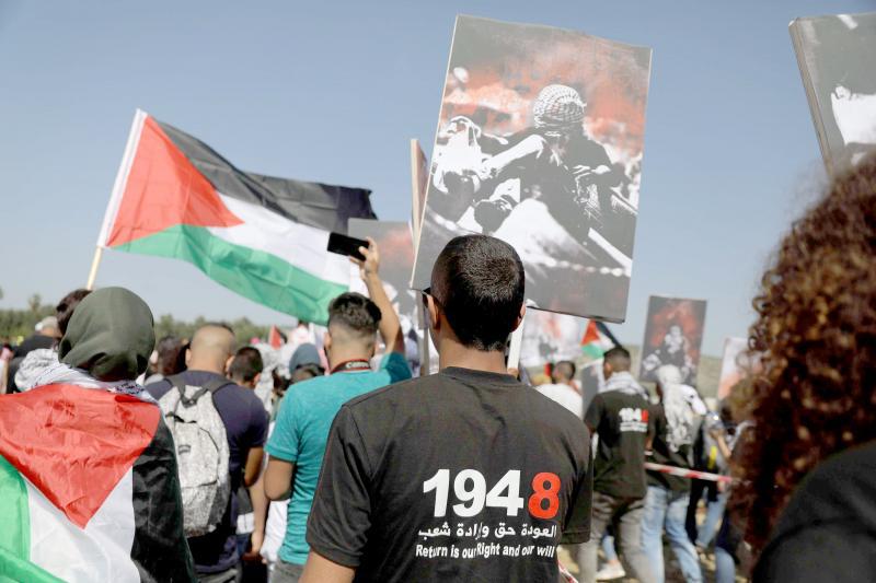 Transcending politics. Israeli Arabs take part in a rally calling for the right of return for refugees who fled their homes during the 1948 Arab-Israeli War, on April 19