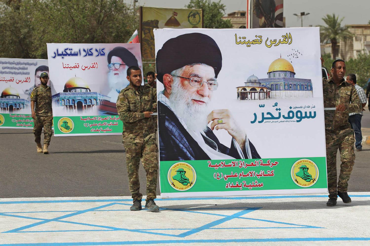 ميليشيات تابعة لإيران تستعرض وسط بغداد