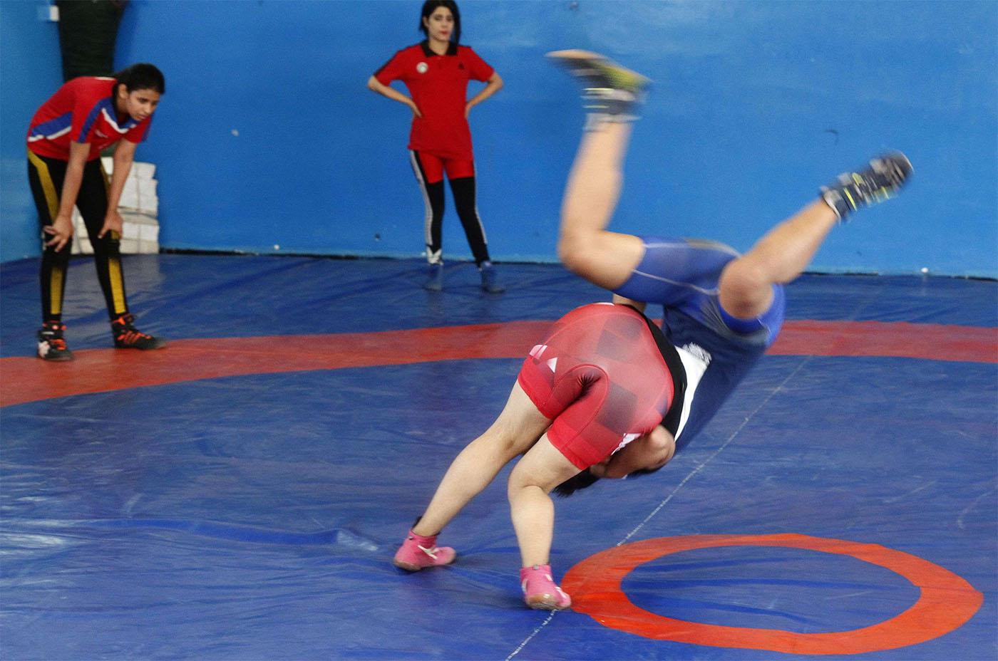Iraqi female wrestlers practise at a gym in Diwaniyah