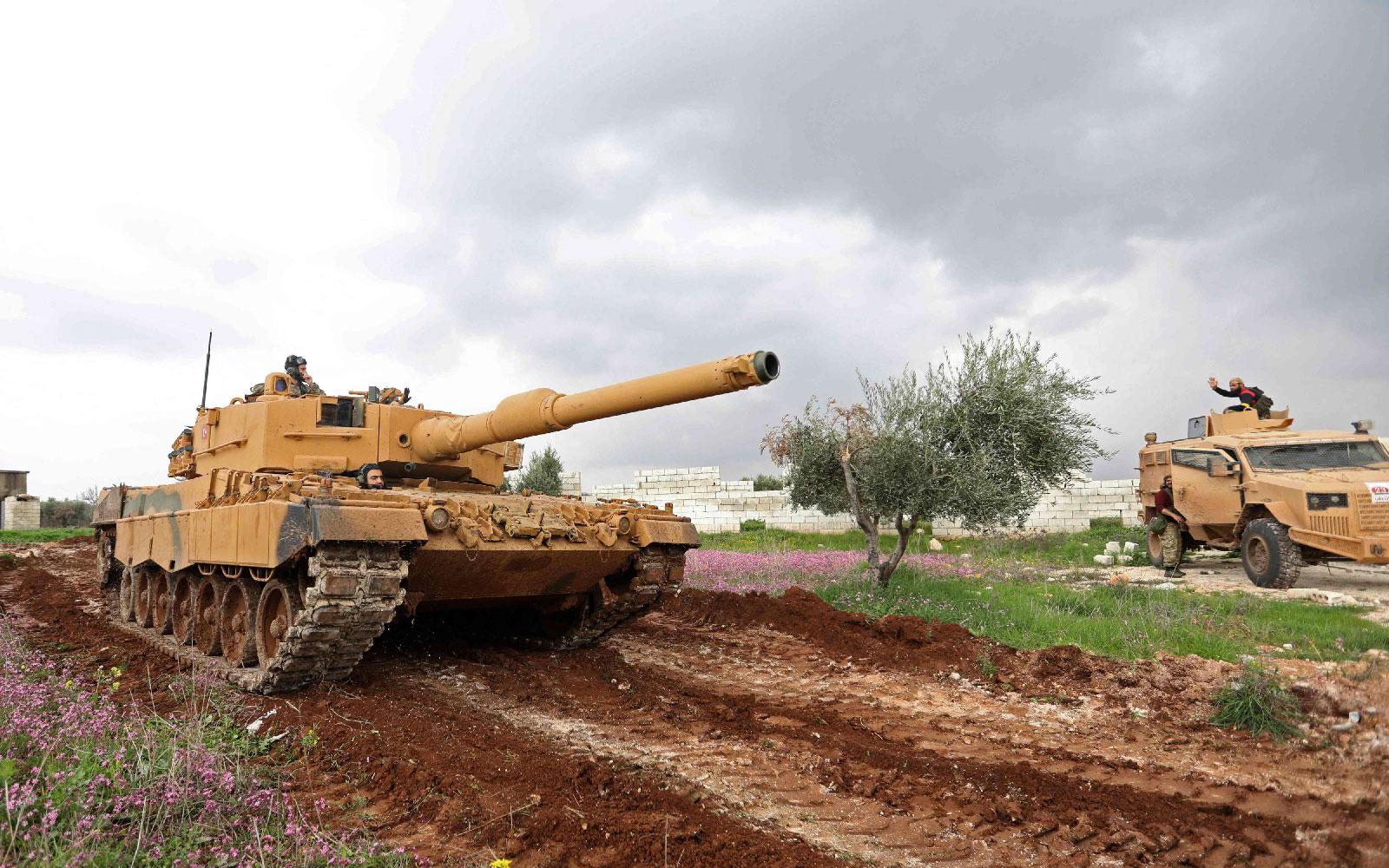 A Turkish military tank is seen during battles between Turkish-led forces and Kurdish fighters.