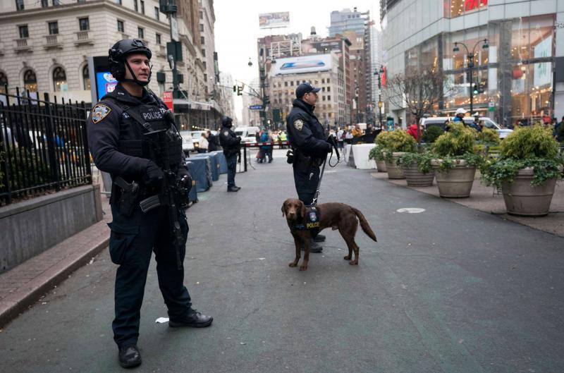Police officers patrol the area around Herald Square in New York