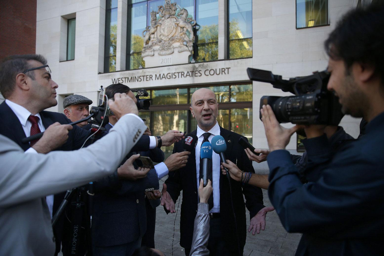 Turkish businessman Akin Ipek speaks to members of the media as he leaves after appearing at Westminster Magistrates Court in London on September 25, 2018.