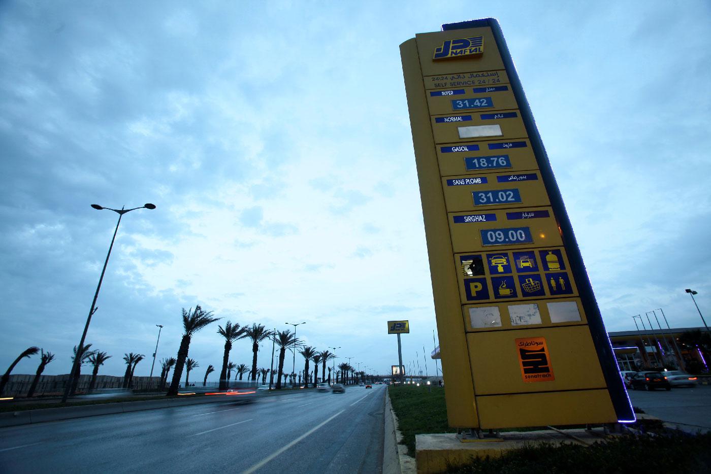 A Naftal billboard shows prices at the entrance of the fuel station in the highway of Algiers, Algeria February 3, 2016.