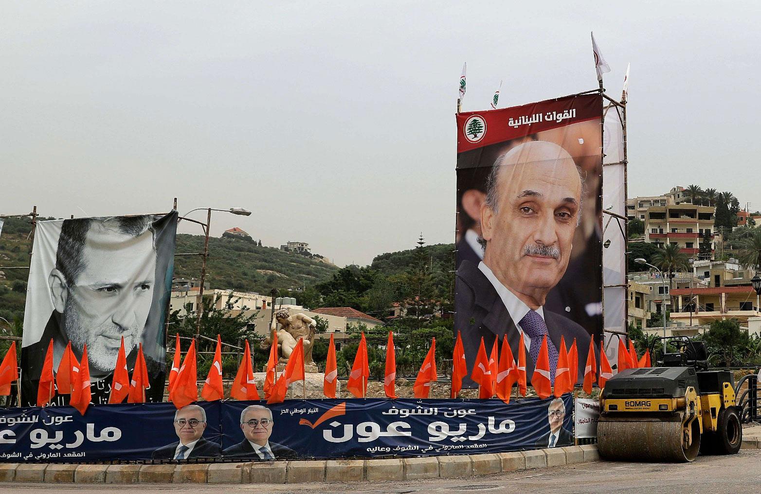 Portraits of the Free Patriotic Movement (FPM) candidate, Foreign Minister Gibran Bassil (L) and the leader of the rival Christian Lebanese forces (LF) group, Samir Geagea (R).