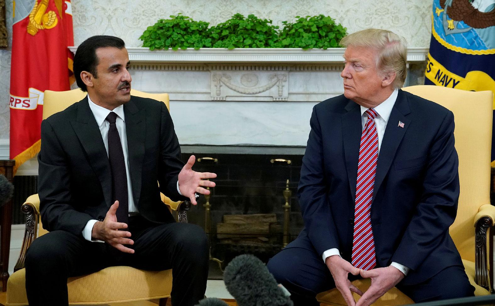 U.S. President Donald Trump meets Qatar's Emir Sheikh Tamim bin Hamad al-Thani in the Oval Office at the White House in Washington, U.S., April 10, 2018. 