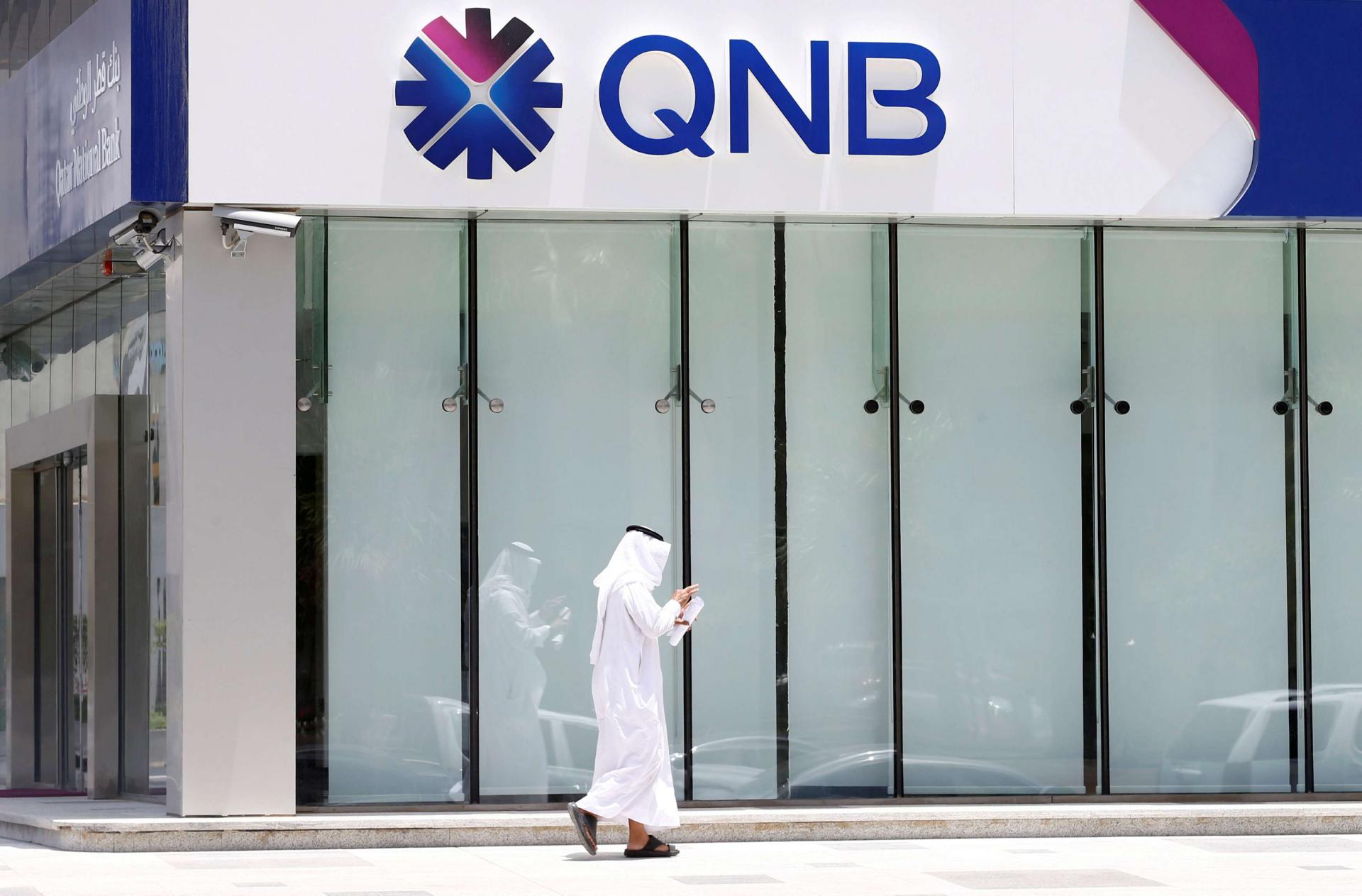 A man walks past a branch of Qatar National Bank (QNB) in Riyadh, Saudi Arabia, June 5, 2017.