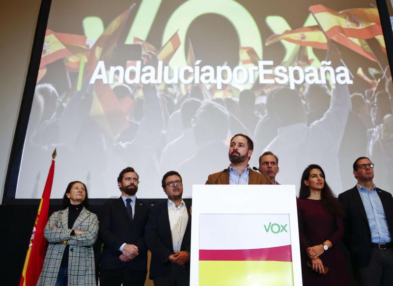 Spain’s far-right Vox party leader Santiago Abascal (C-R) speaks during a news conference in Seville, December 3