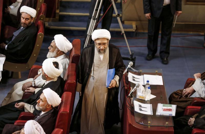 Iranian Judiciary chief Sadeq Larijani (C) attends a session of the Assembly of Experts in Tehran. 