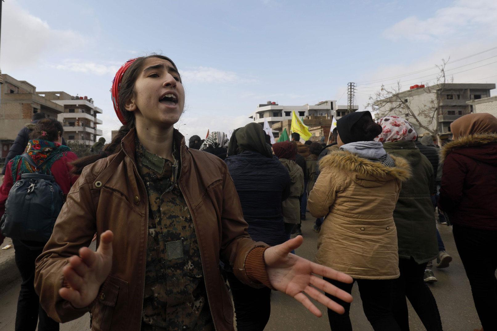 Syrian Kurds take part in a demonstration in the northeastern Syrian Kurdish-majority city of Qamishli on December 28, 2018, against threats from Turkey to carry out a fresh offensive following the US decision to withdraw their troops.