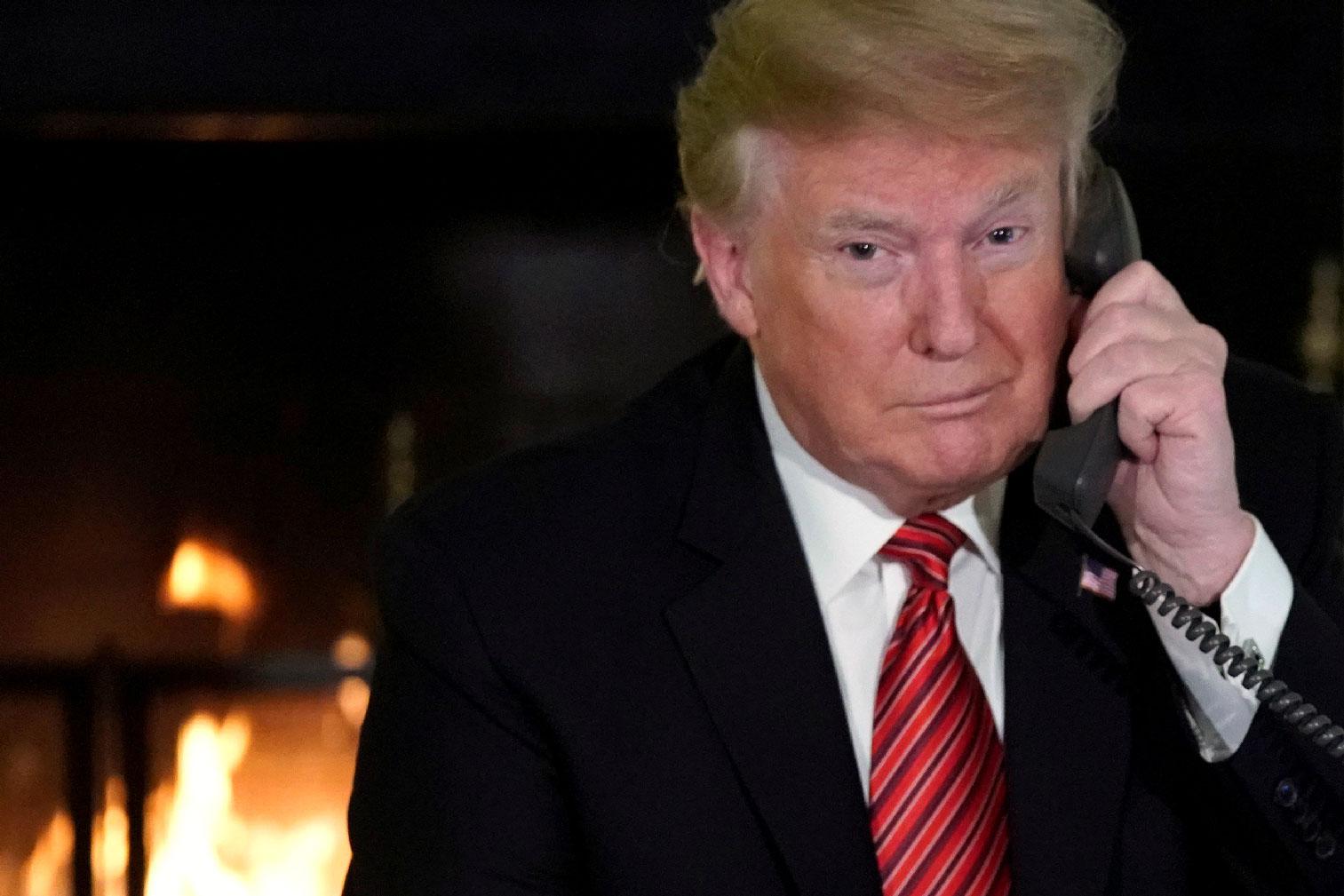 US President Donald Trump participates in NORAD Santa tracker phone calls from the White House in Washington, US December 24, 2018.