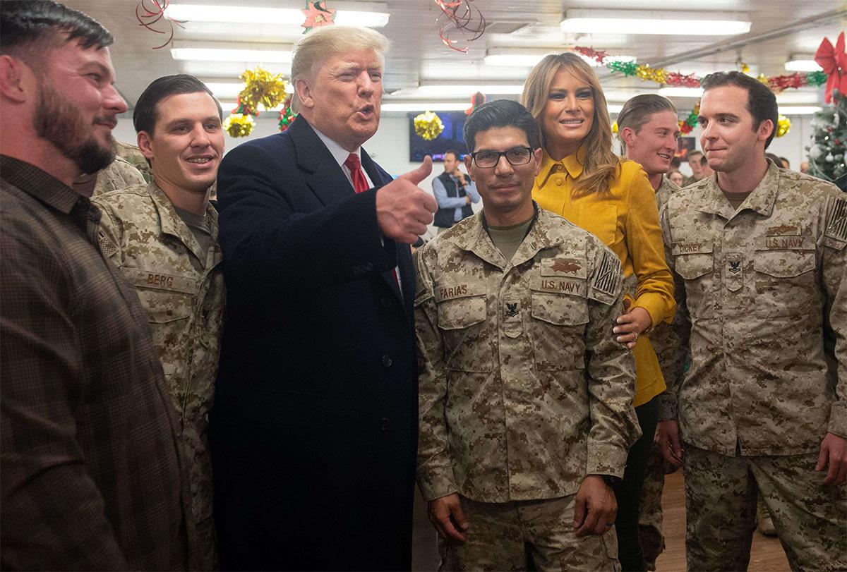  US President Donald Trump and First Lady Melania Trump greet members of the US military during an unannounced trip to Al Asad Air Base in Iraq 