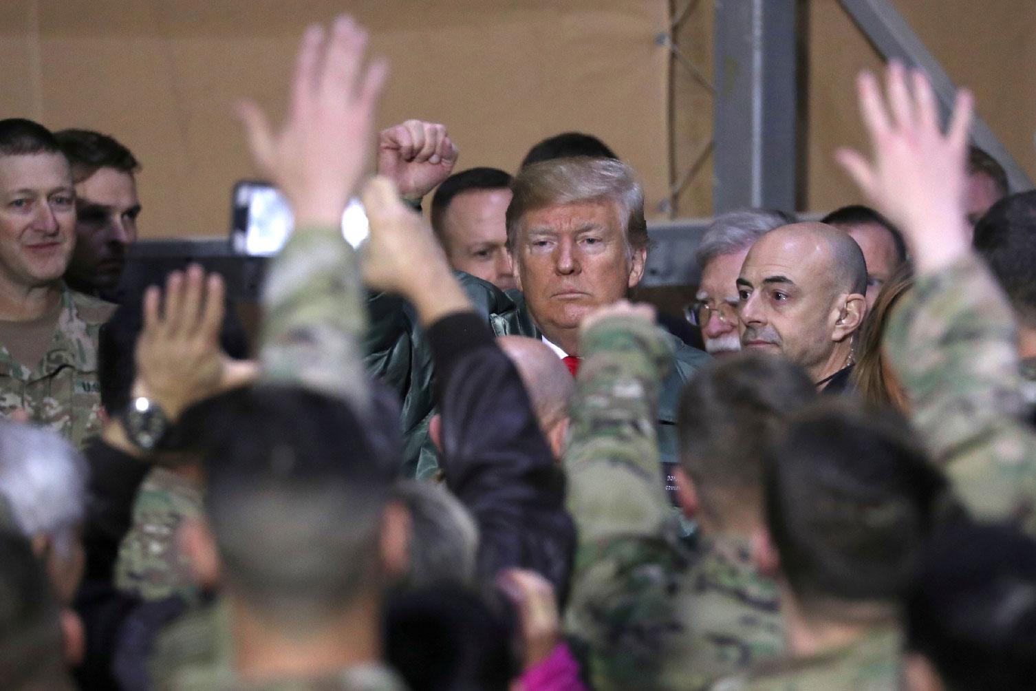 US President Donald Trump delivers remarks to U.S. troops on an unannounced visit to Al Asad Air Base, Iraq on December 26, 2018.