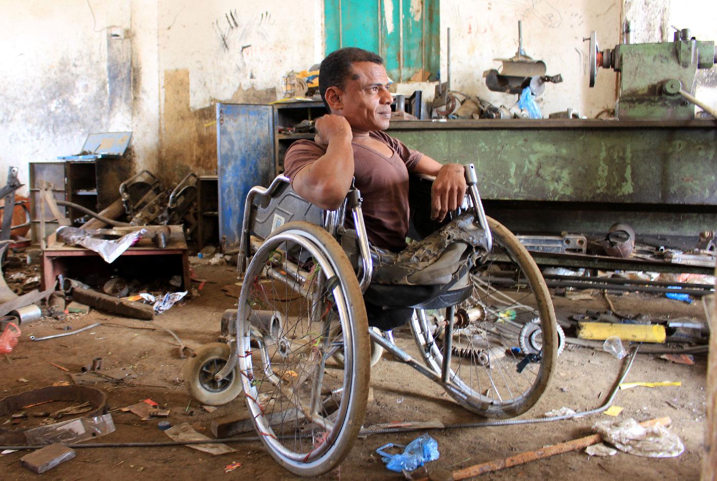 Yaarub Eissa sits in his wheelchair at a blacksmith workshop where he works in Abs, in the northern province of Hajjah, Yemen January 19, 2019.