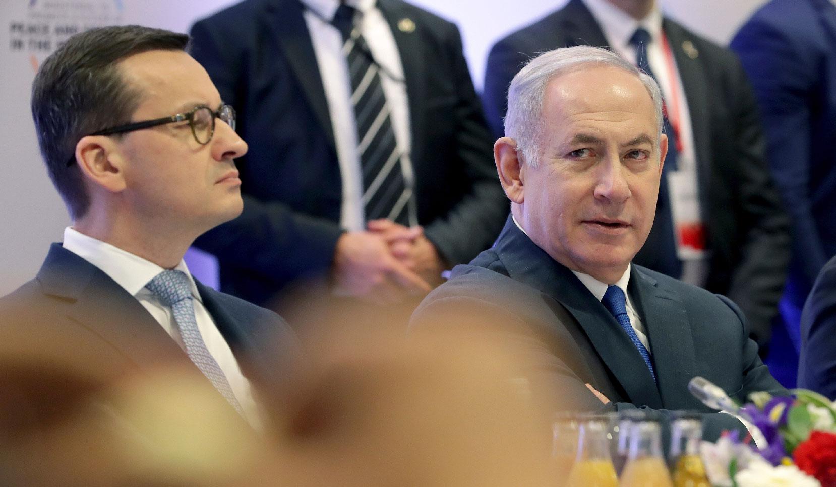 Feb. 14, 2019 photo shows Poland's Prime Minister Mateusz Morawiecki, left, and Israeli Prime Minister Benjamin Netanyahu, right, attend a meeting in Warsaw, Poland.