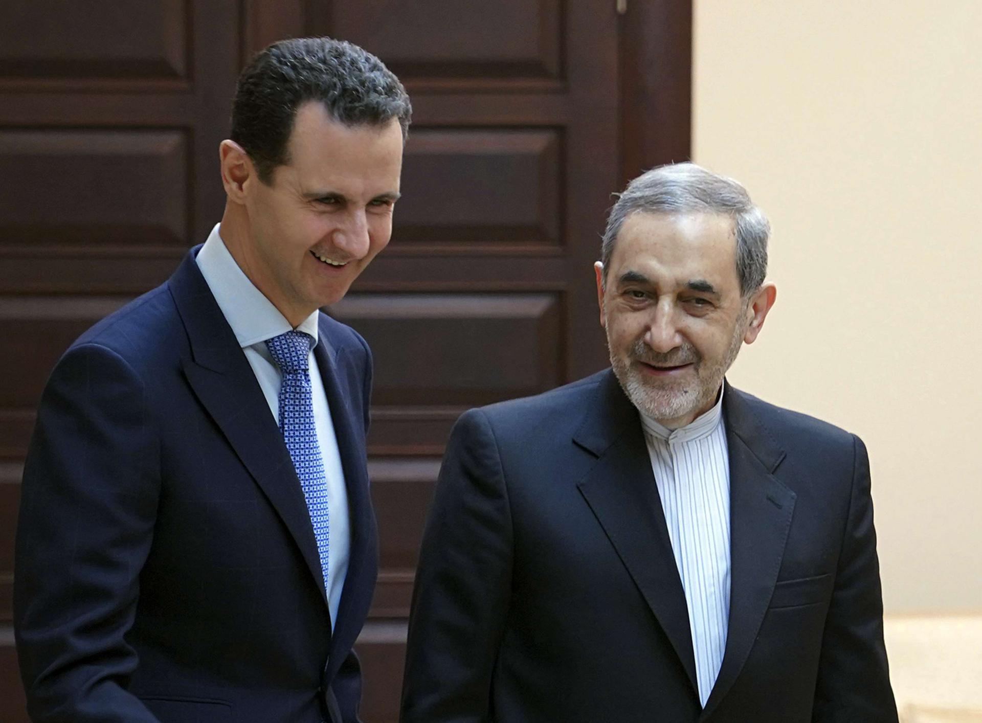 Syrian president Bashar Assad, left, meets with Ali Akbar Velayati, an adviser to Iran's Supreme Leader Ayatollah Ali Khamenei, in Damascus, Syria, Thursday, April 12, 2018.