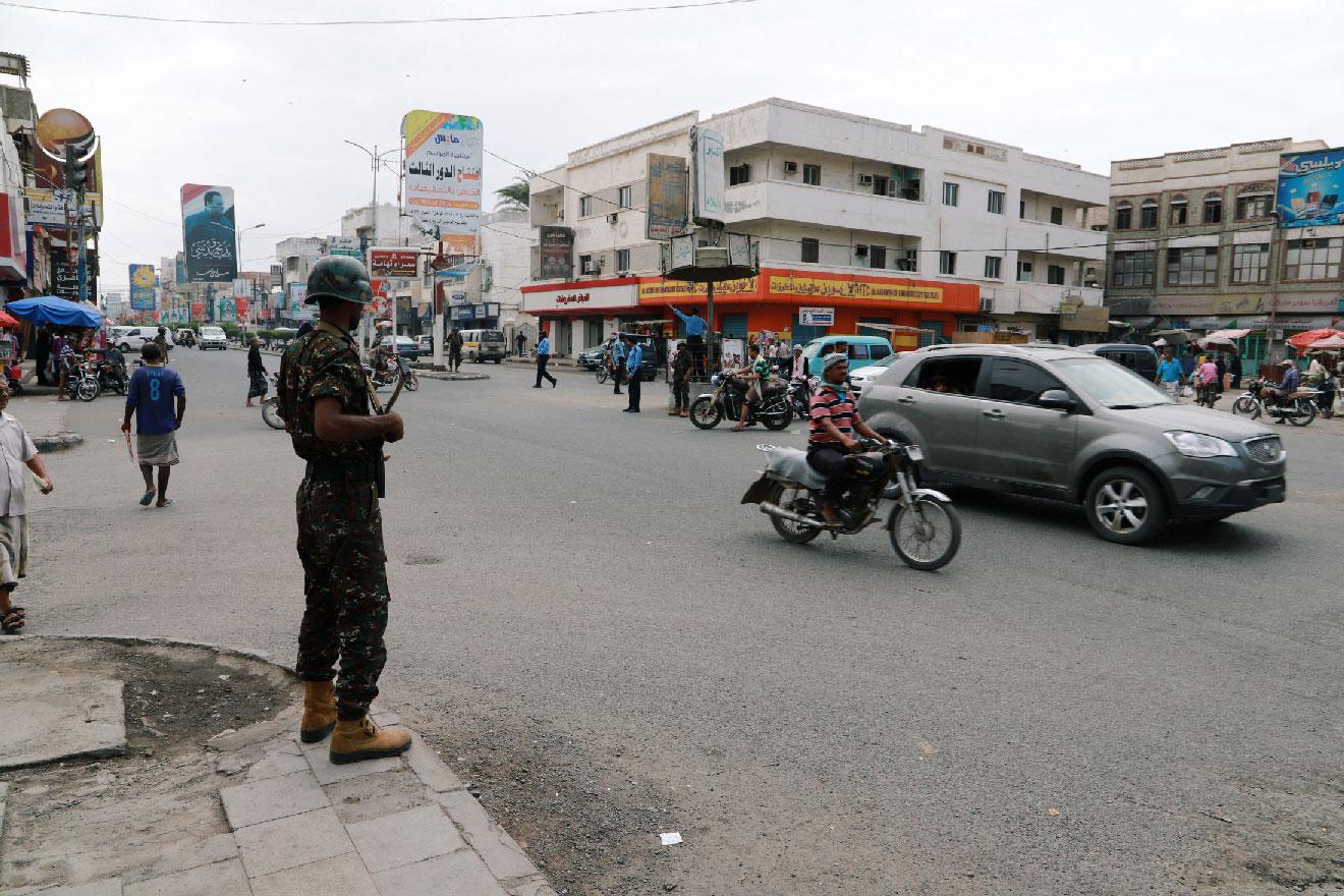 Police trooper stands guard on a street in the Red Sea port city of Hodeidah, Yemen February 13, 2019.