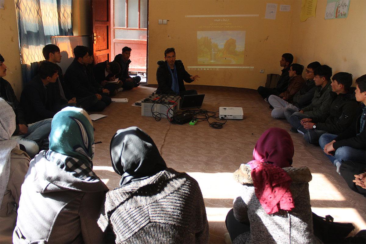 Muhammad Ali teaching a “relational learning circle” class during orientation at the APV Borderfree Center