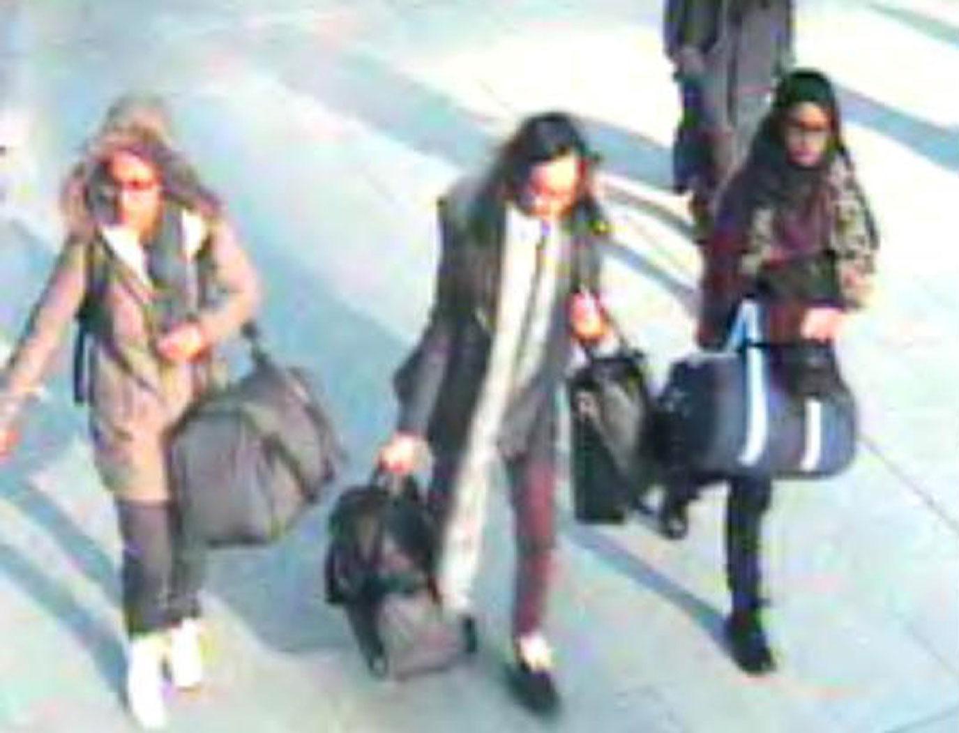 In this file handout photo taken on February 17, 2015 a video grab taken from CCTV, received from the Metropolitan Police Service (MPS) on February 23, 2015, shows (L-R) British teenagers Amira Abase, Kadiza Sultana and Shamima Begum at Gatwick Airport, south of London.