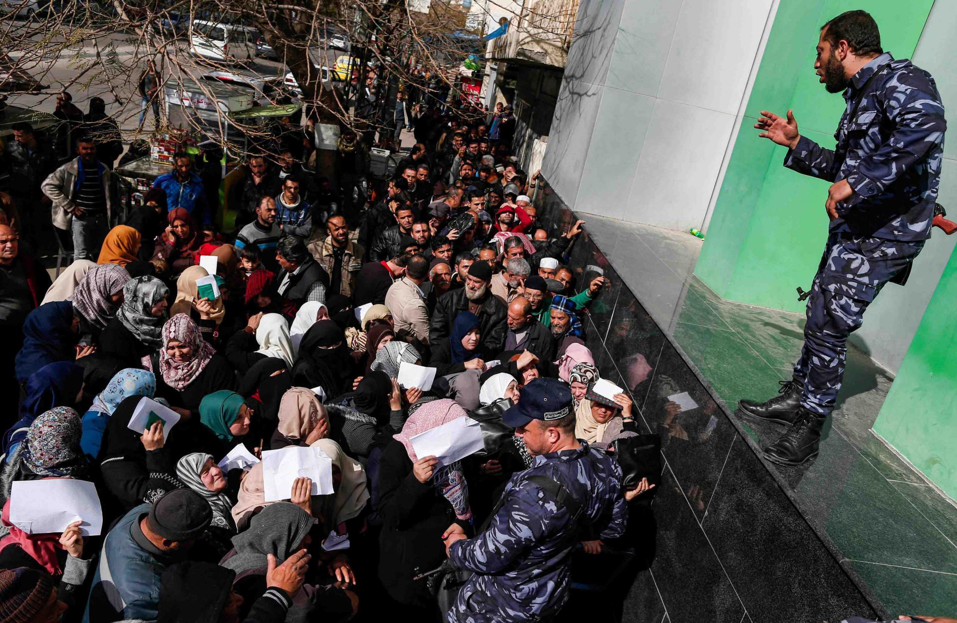 Thousands of Palestinians could be seen queueing early at post offices across Gaza