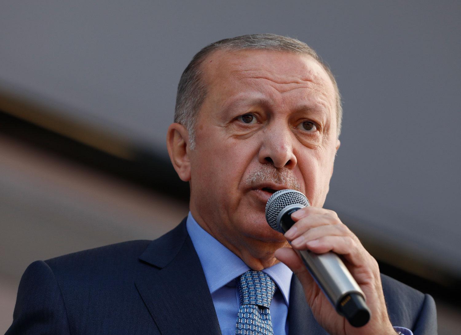 In this Thursday, March 14, 2019 photo, Turkey's President Recep Tayyip Erdogan addresses the supporters of his ruling Justice and Development Party, AKP, during a rally in Ankara, Turkey.
