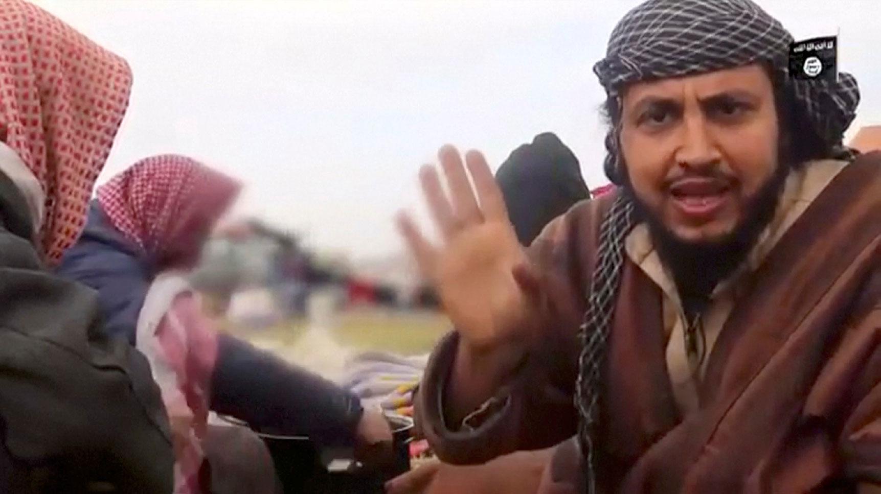 A man said to be an Islamic State militant, Abu Abd Al-Azeem, speaks in Baghouz, Syria in this still image taken from a video obtained by Reuters March 12, 2019.