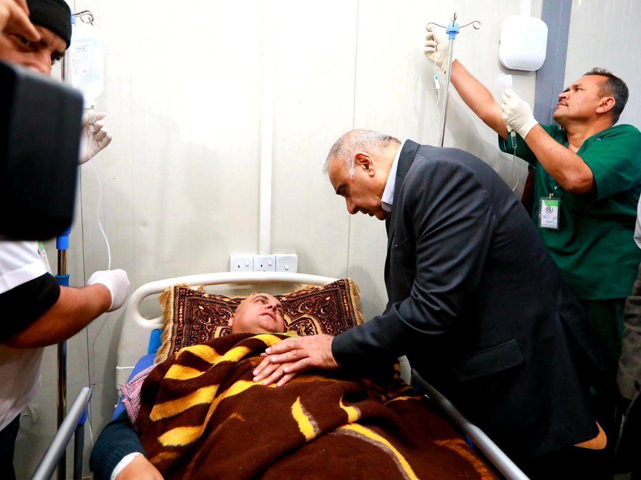 Iraq's Prime Minister Adel Abdul Mahdi visits the people injured after a ferry sank in the Tigris river, at Salam hospital in Mosul, Iraq March 21, 2019. 