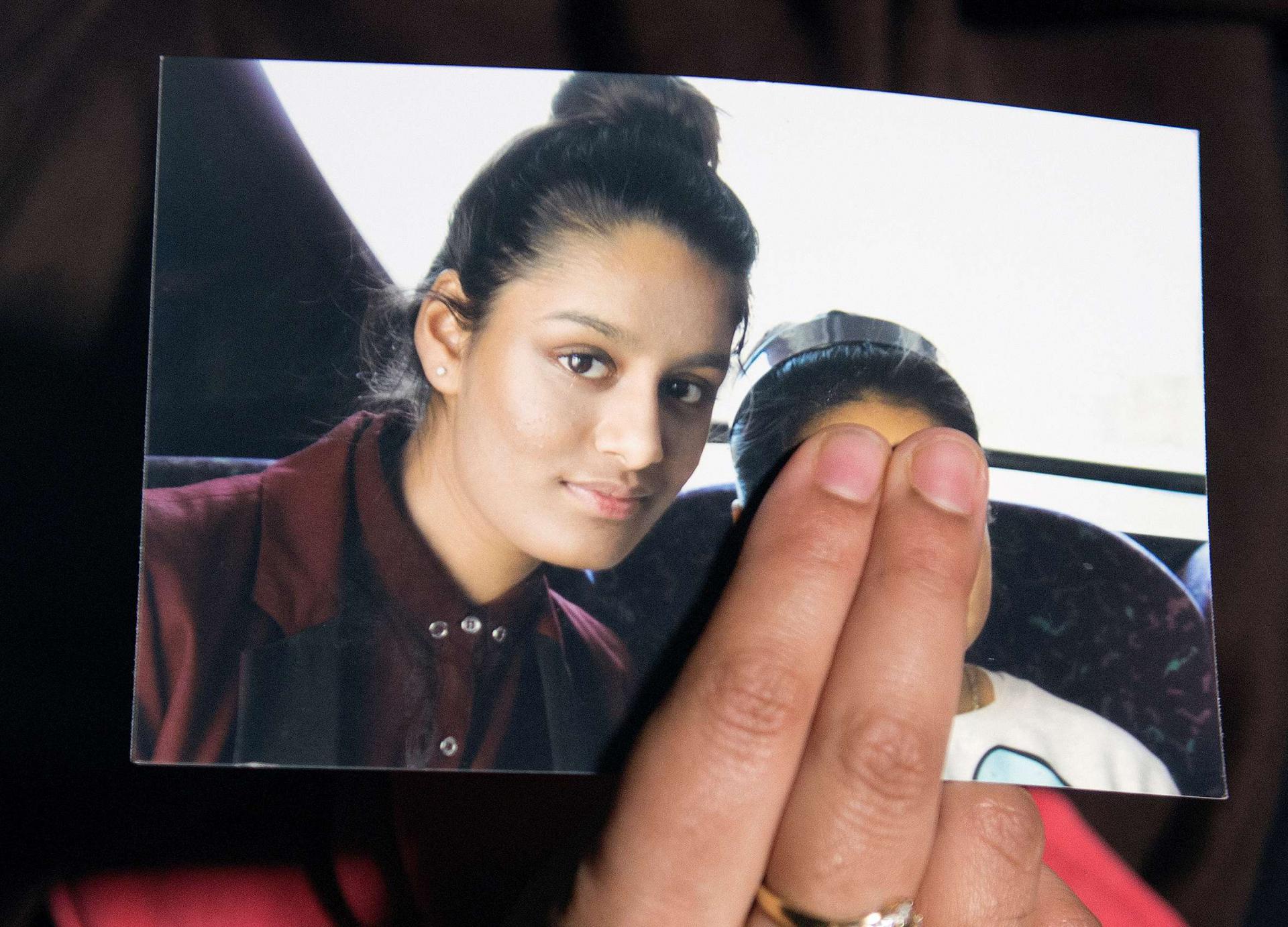 Renu Begum, sister of teenage British girl Shamima Begum, holds a photo of her sister as she makes an appeal for her to return home at Scotland Yard, in London, Britain February 22, 2015.