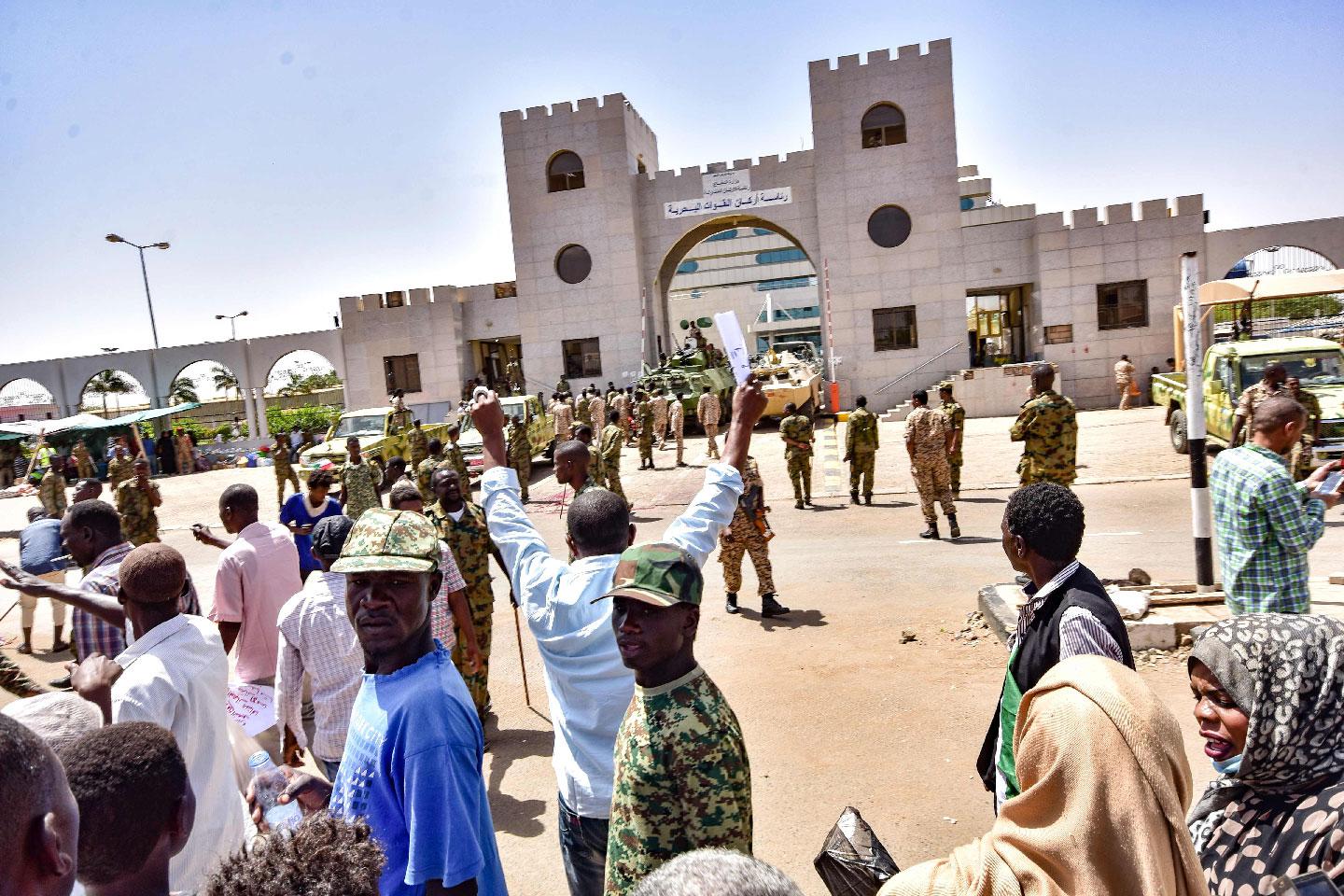 Sudanese demonstrators gather during a rally demanding civilian rule outside army headquarters in Khartoum.