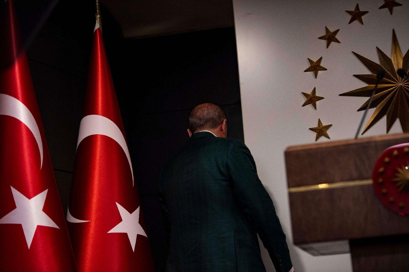 Erdogan leaves stage after giving a statement following the local elections in Istanbul