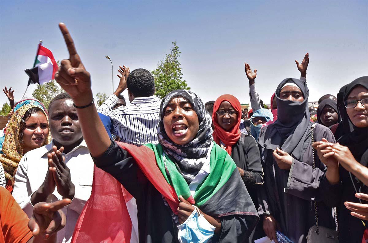 Sudanese demonstrators gather near the military headquarters in Khartoum