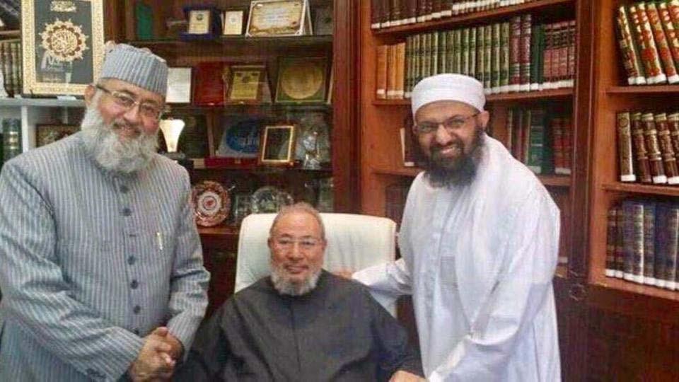 Qaradwi (C) with National Towheed Jamaat in his office in Qatar