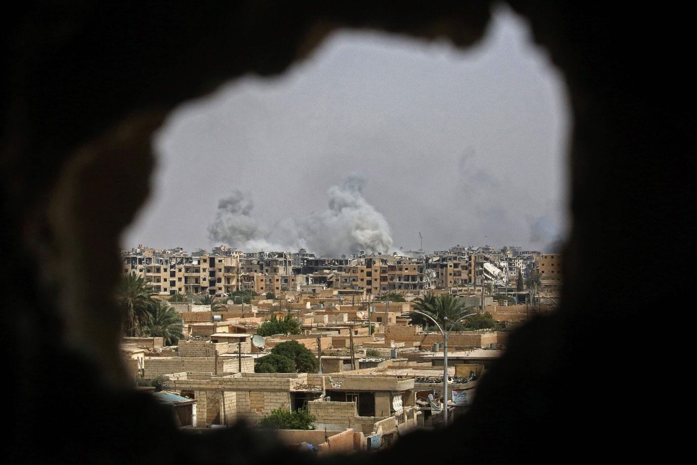 Smoke billows out following a coalition air strike in the western al-Daraiya neighbourhood of the embattled northern Syrian city of Raqa on Sept. 5, 2017