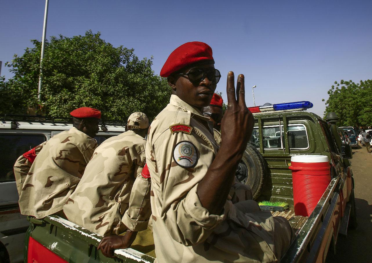 A Sudanese soldier flashes the victory sign