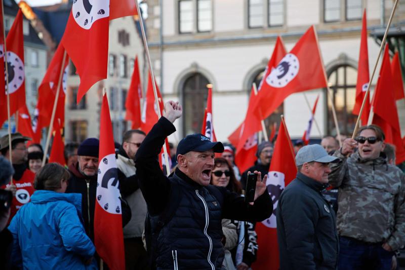 Far-right supporters shout slogans in the eastern German city of Chemnitz