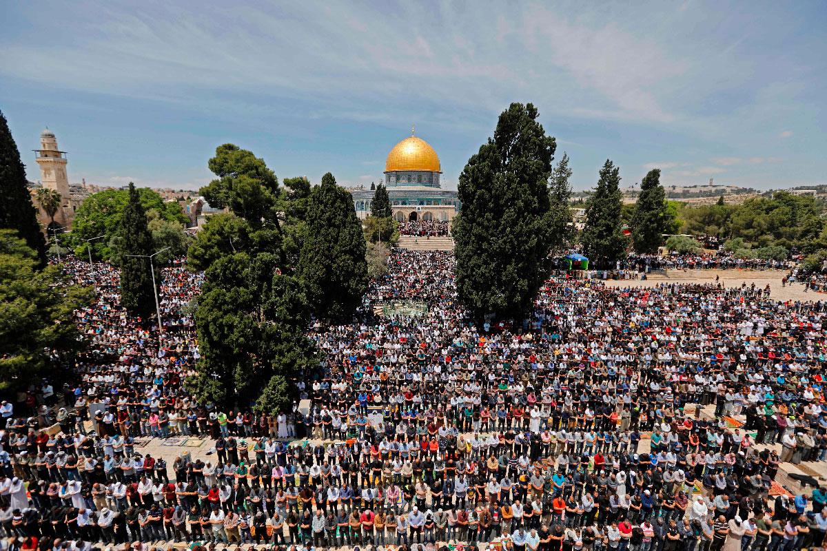 Palestinian Muslim worshippers pray in the al-Aqsa Mosque compound