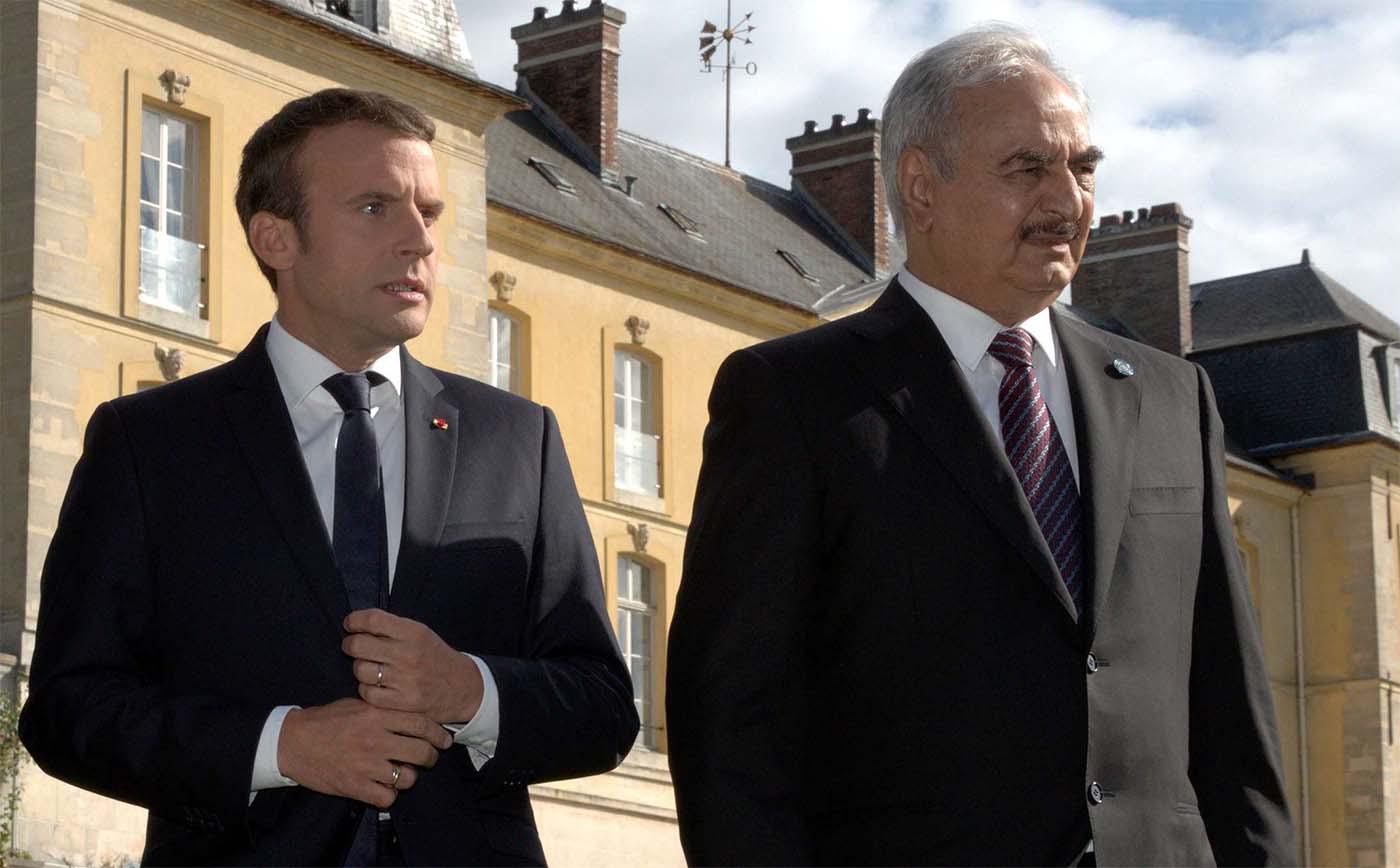 French President Emmanuel Macron with Khalifa Haftar (R)