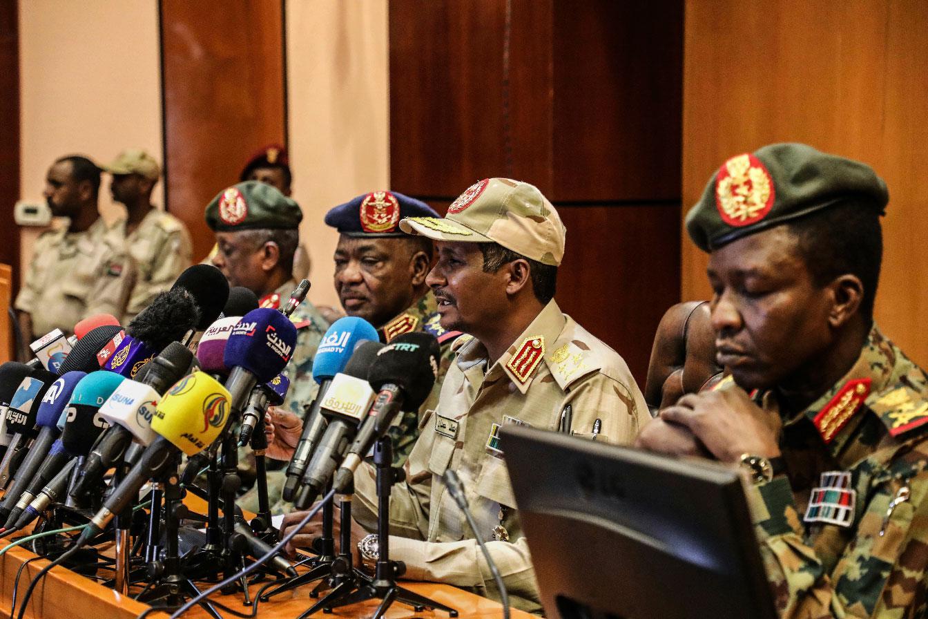 Gen. Mohamed Hamdan Dagalo, the deputy head of the military council, second right, speaks at a press conference in Khartoum