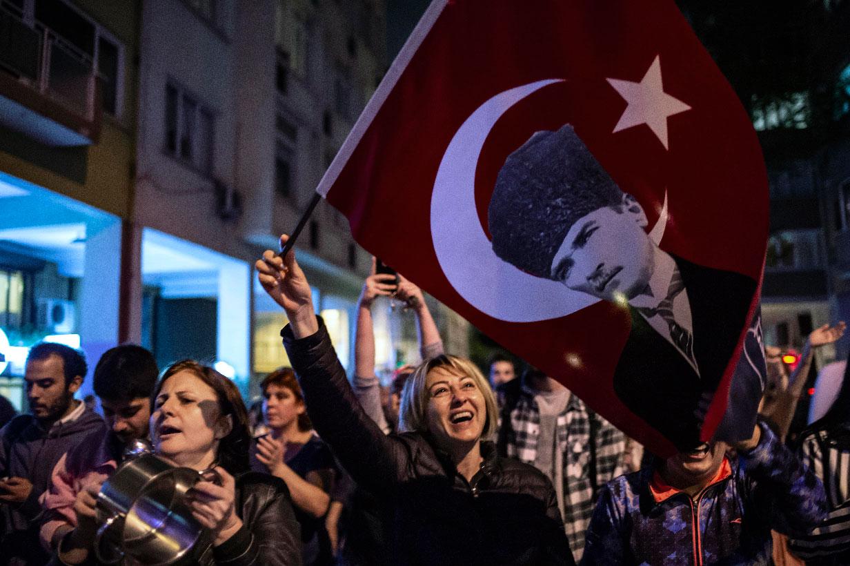 People shout anti-government slogans as they protest against a re-run of the election in Istanbul