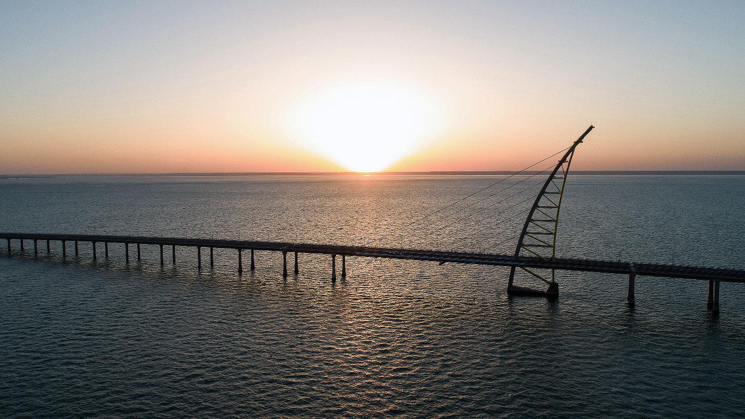 Sunset view of the arch pylon on the Sheikh Jaber al-Ahmad Al-Sabah Causeway which will lead to the Future Silk City