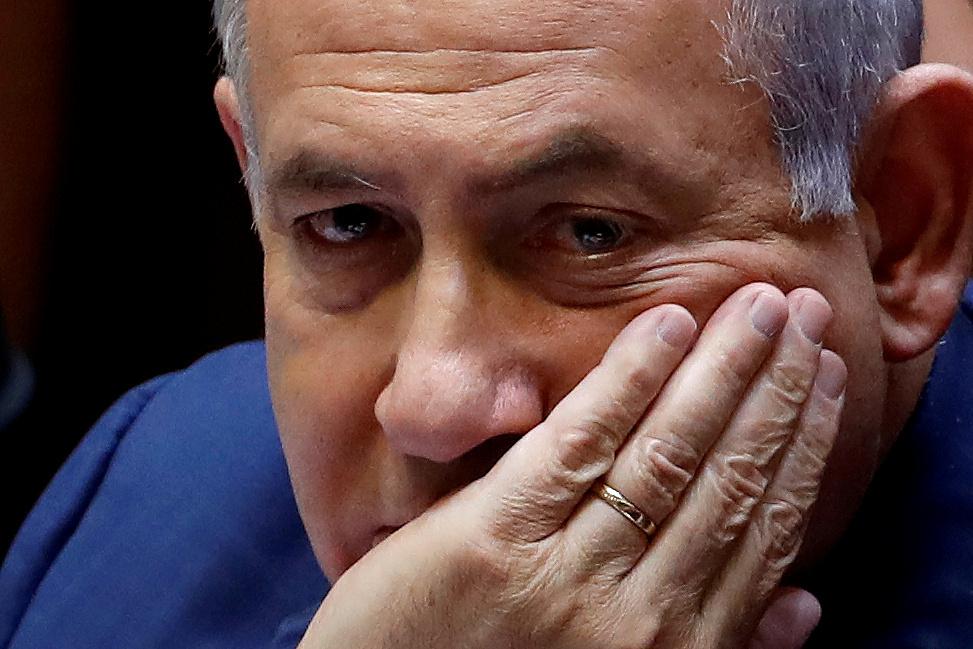 Israeli Prime Minister Benjamin Netanyahu sits at the plenum at the Knesset