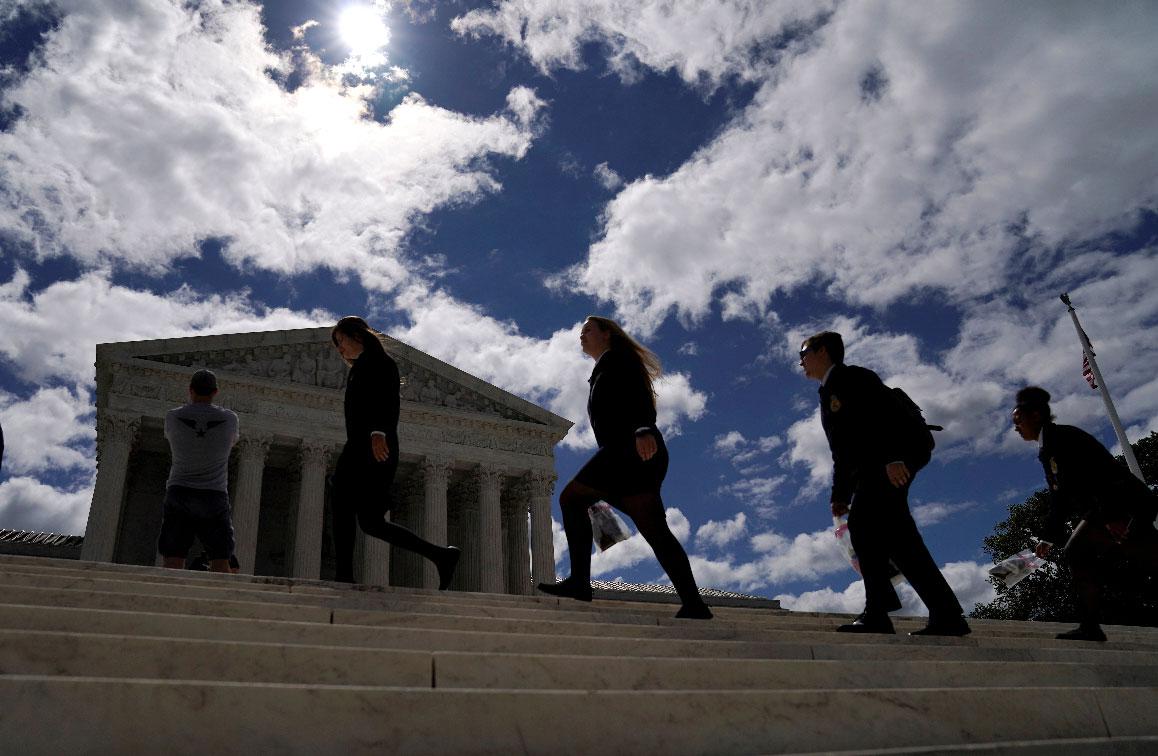 Students walk up the steps during a visit to the US Supreme Court in Washington