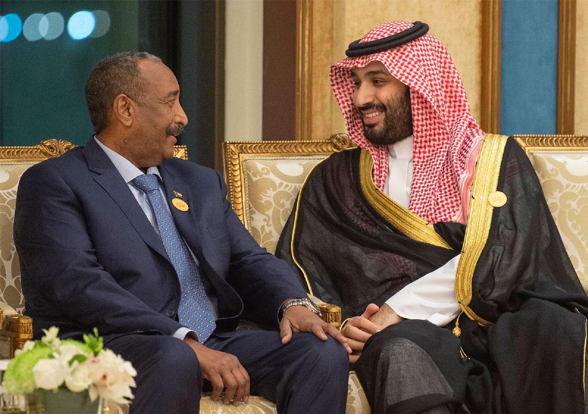 Crown Prince Mohammed bin Salman (R) of Saudi Arabia talking to General Abdel Fattah al-Burhan, head of Sudan's ruling Transitional Military Council