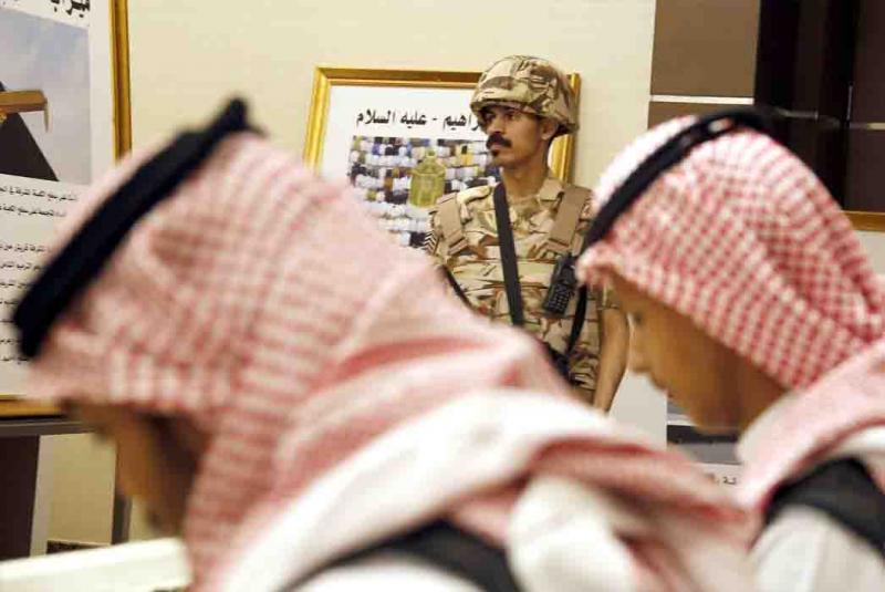 A Saudi soldier stands guard at the press centre for the Arab and Islamic summits in Mecca, May 30