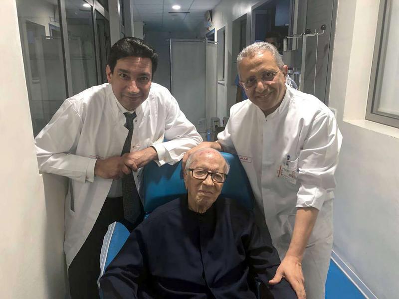 Tunisian President Beji Caid Essebsi surrounded by his doctors on July 1, 2019 before leaving the Tunis Military Hospital.