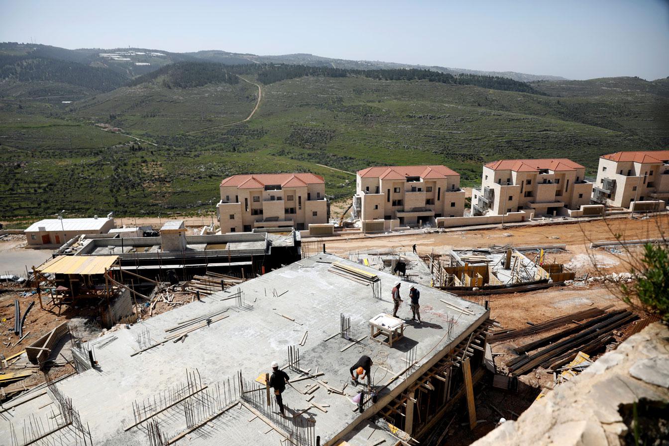 Labourers work at a construction site in the Israeli settlement of Beitar Illit in the Israeli-occupied West Bank