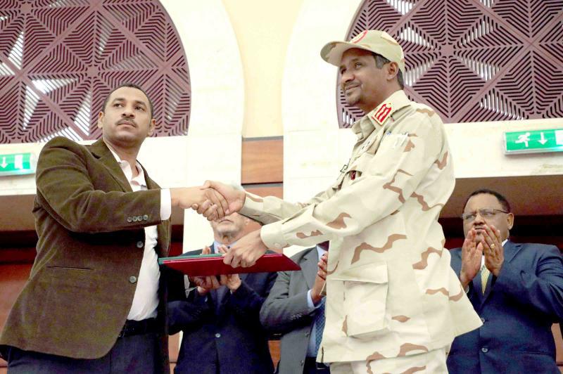 Opposition alliance coalition’s leader Ahmad al-Rabiah and Deputy Head of Sudanese Transitional Military Council Mohamed Hamdan Dagalo