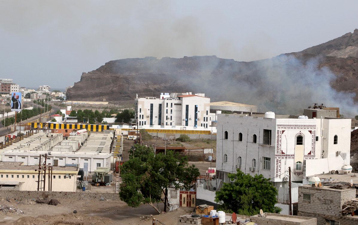 Smoke rises during fighting in Aden