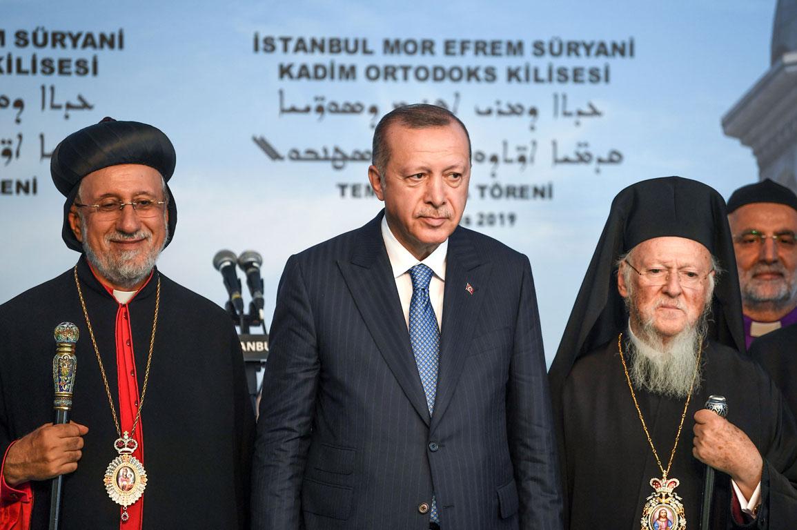 Turkish President Recep Tayyip Erdogan (C), Syriac (Assyrian) Orthodox Patriarch Yusuf Cetin (L) and Ecumenical Patriarch of Constantinople Bartholomew I (R)
